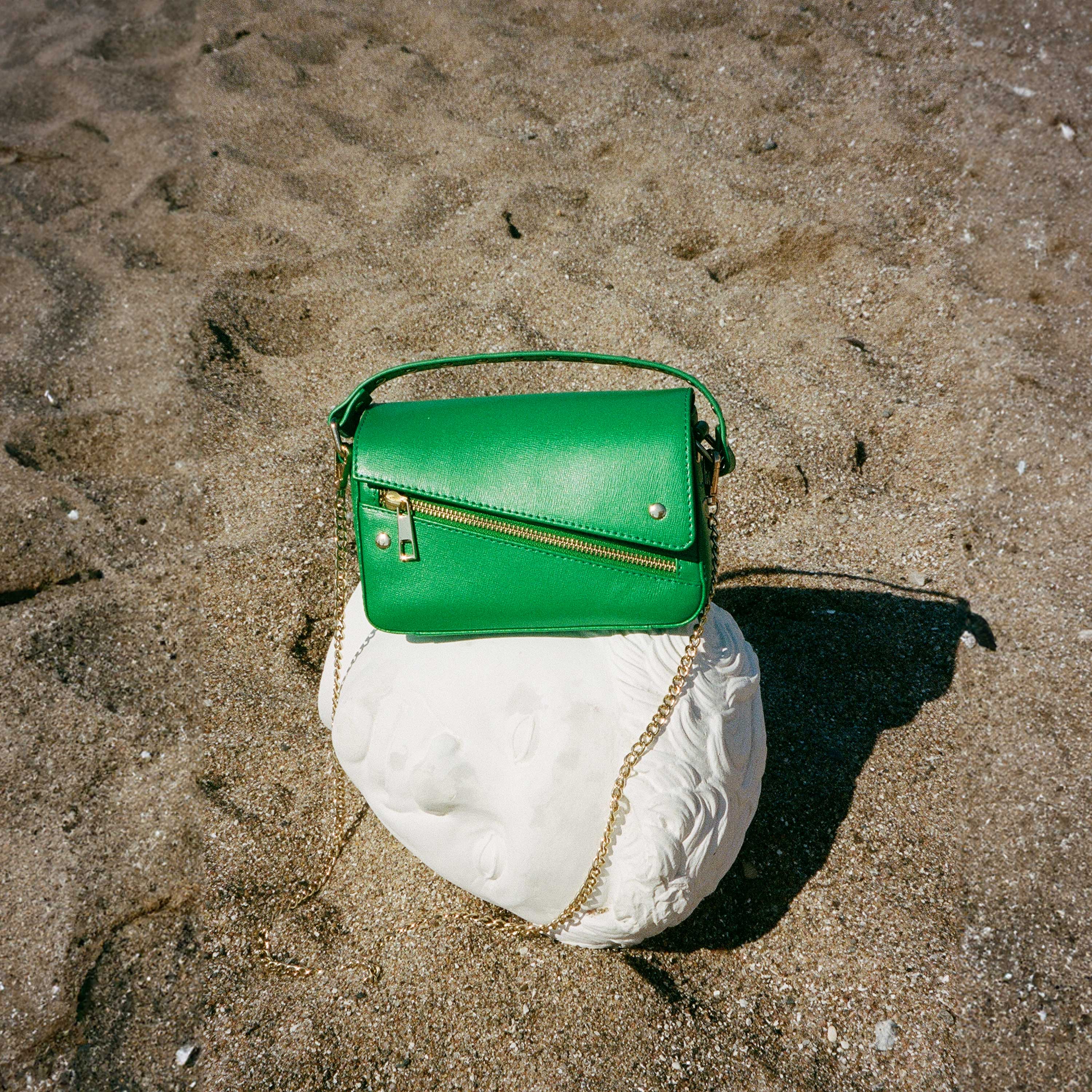 Small green fashion and gold bag